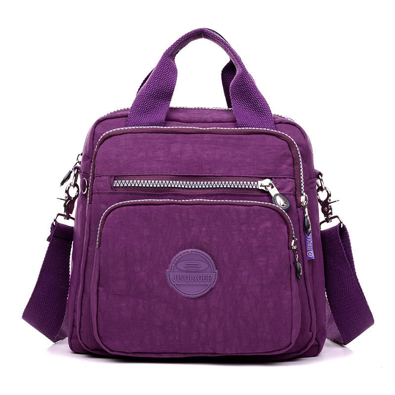 Woman wearing a stylish water-resistant crossbody bag, ideal for travel or daily errands.