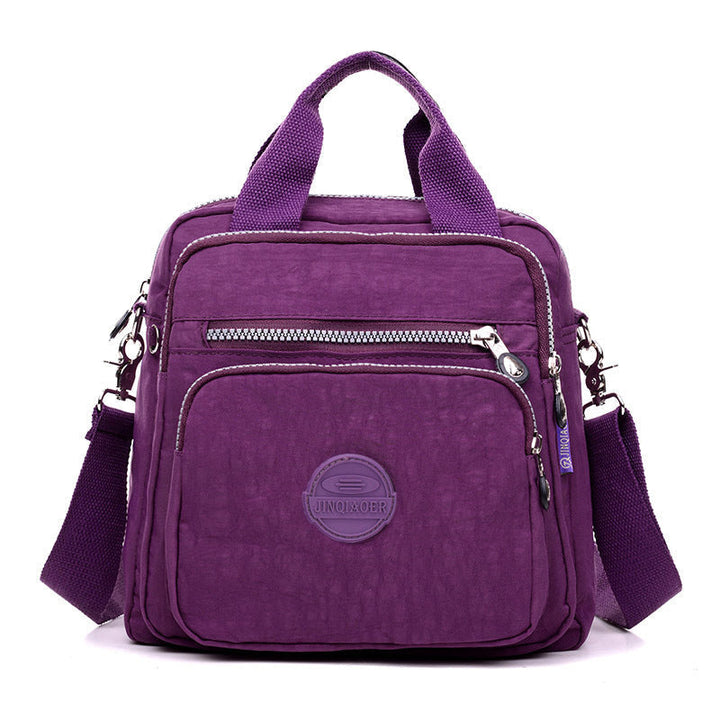 Woman wearing a stylish water-resistant crossbody bag, ideal for travel or daily errands.