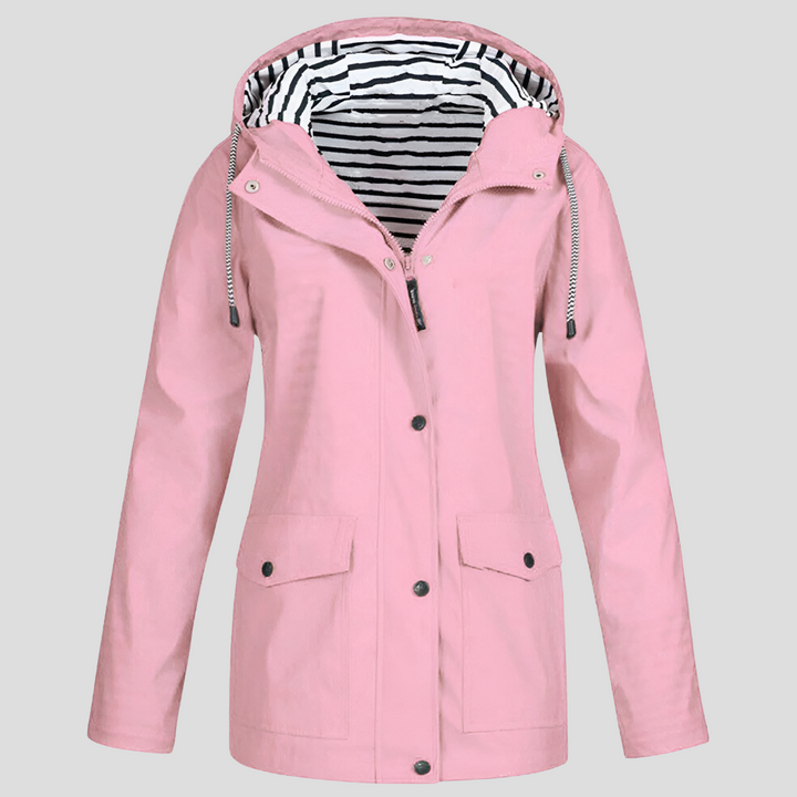Versatile women's rain jacket with hood, great for hiking and outdoor exploration.