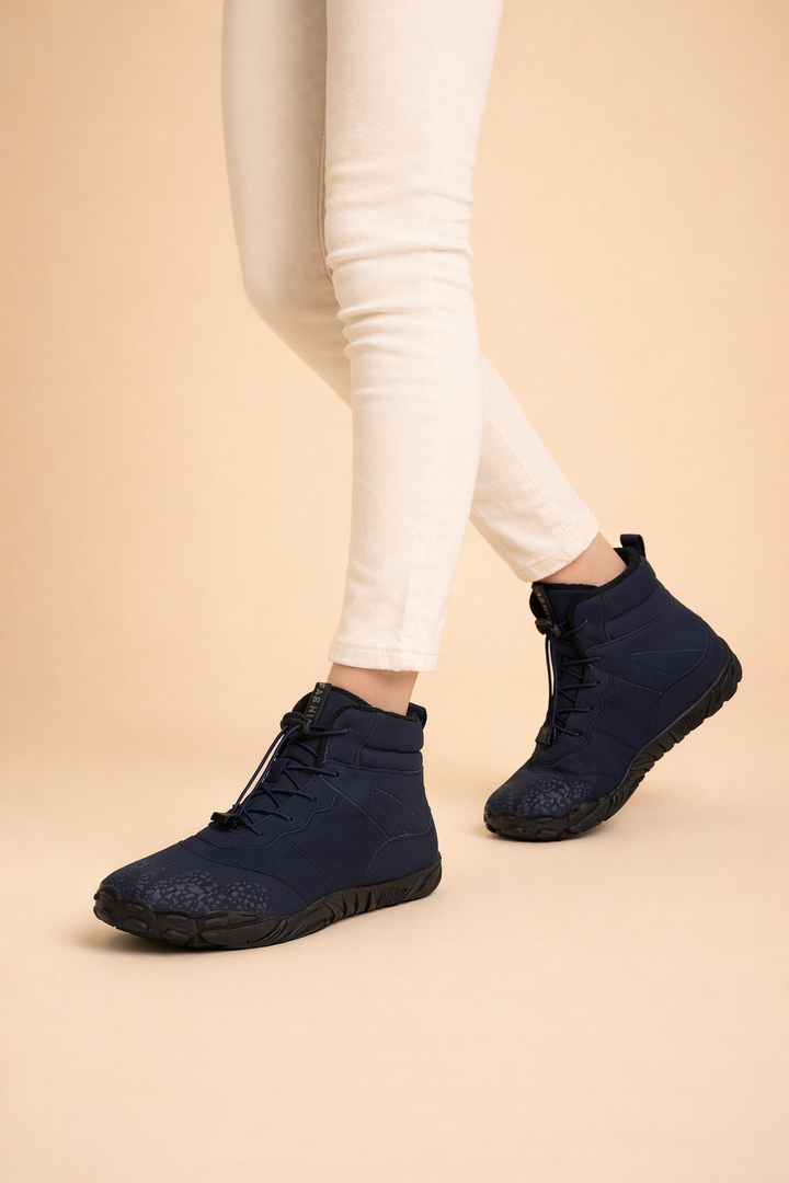 Modern women's waterproof barefoot winter boots, sleek minimalist design, warm & protective.