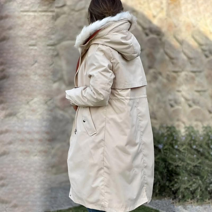 Back view of a women's lightweight hooded jacket, showing its practical design.