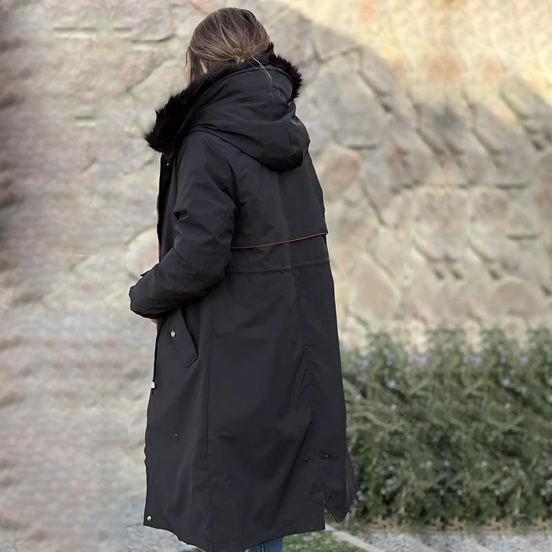 Detail of the waterproof fabric on a women's outdoor hooded jacket.