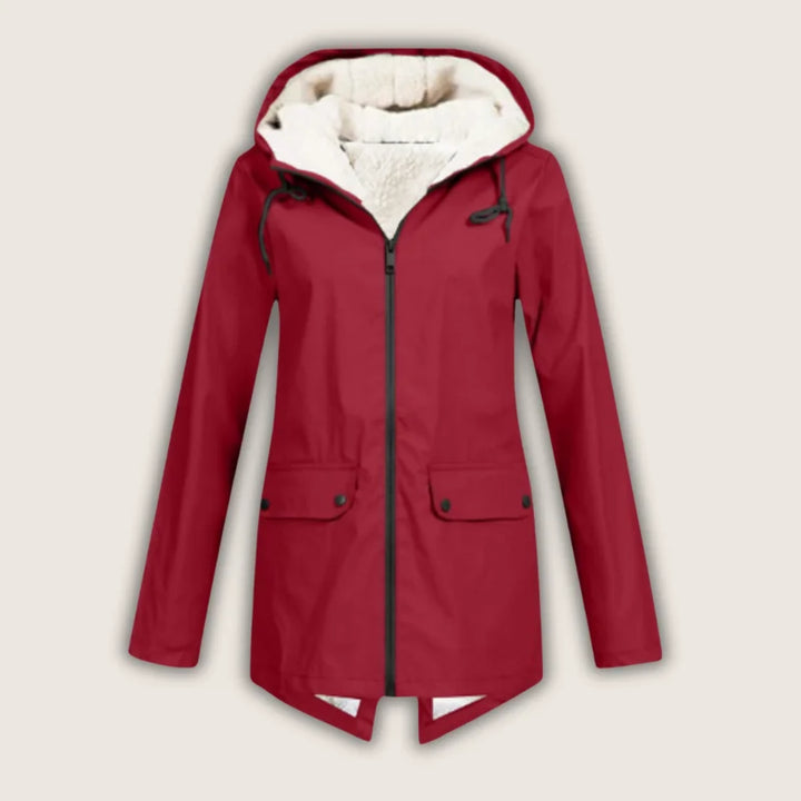 Women's waterproof hooded jacket with front pockets, ideal for rain and wind protection.