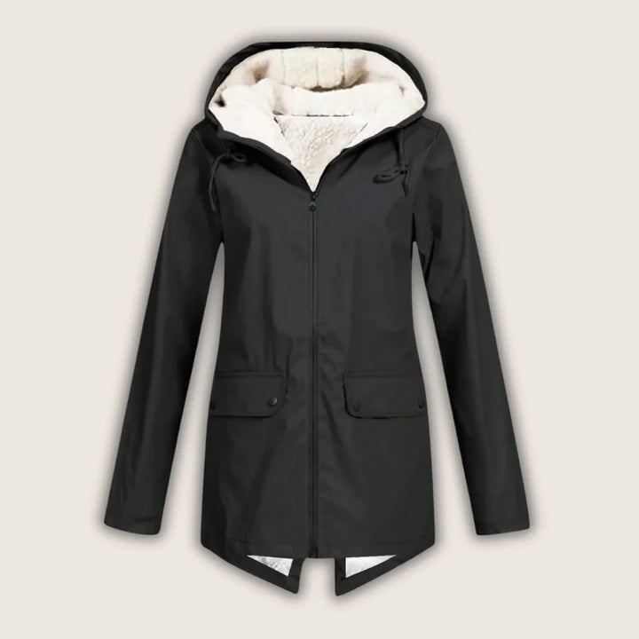 Women's waterproof rain jacket with hood and front pockets, durable and stylish for outdoor wear.