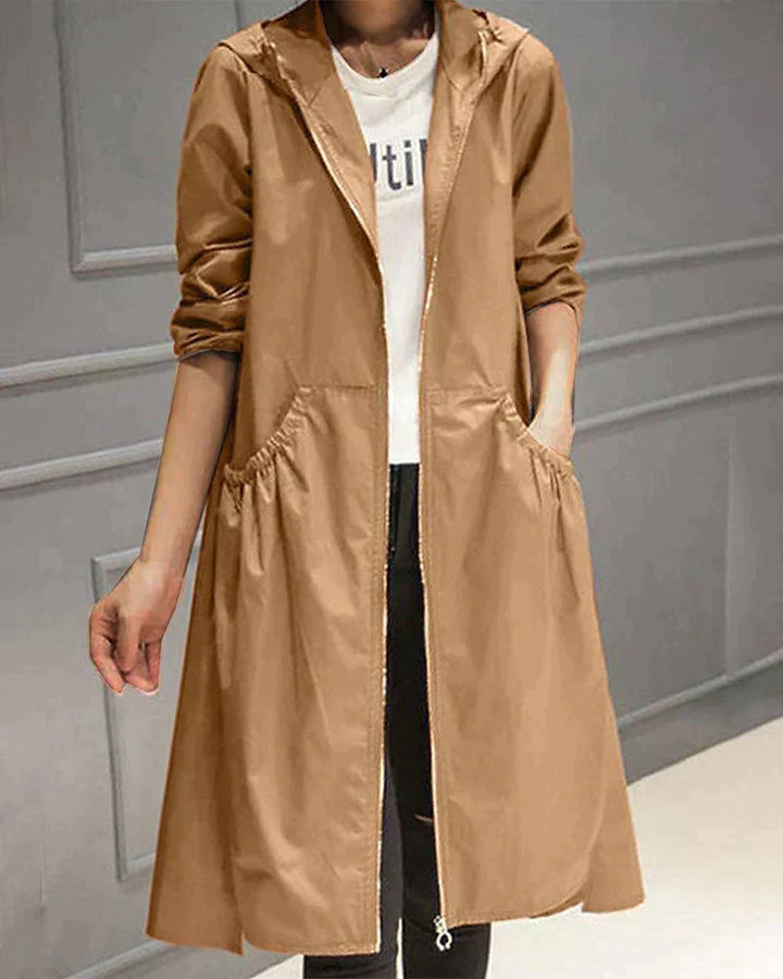 Everyday women's rain jacket, knee-length, waterproof & hooded, relaxed fit for practical all-weather outerwear.