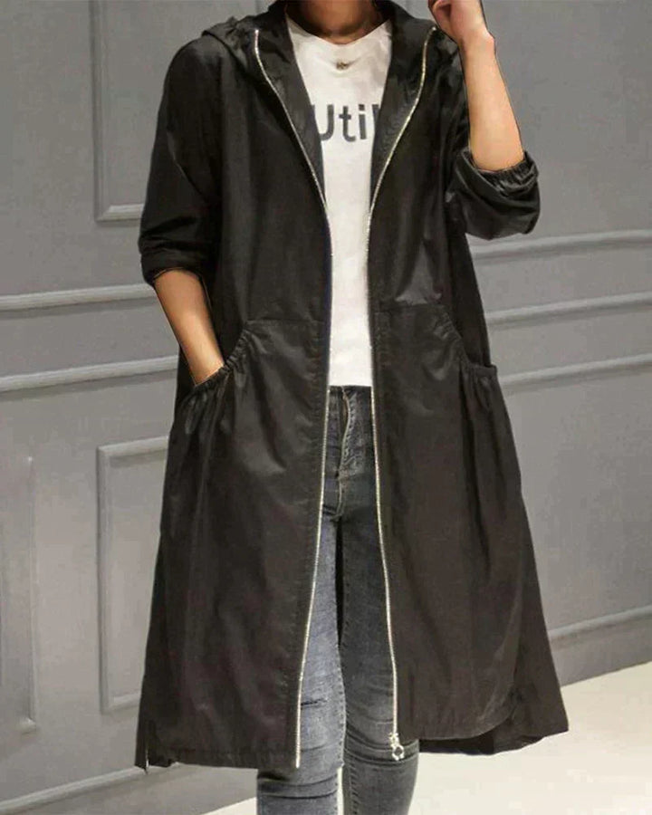 Comfortable relaxed fit women's hooded jacket, knee-length & waterproof, ideal for daily all-weather protection.