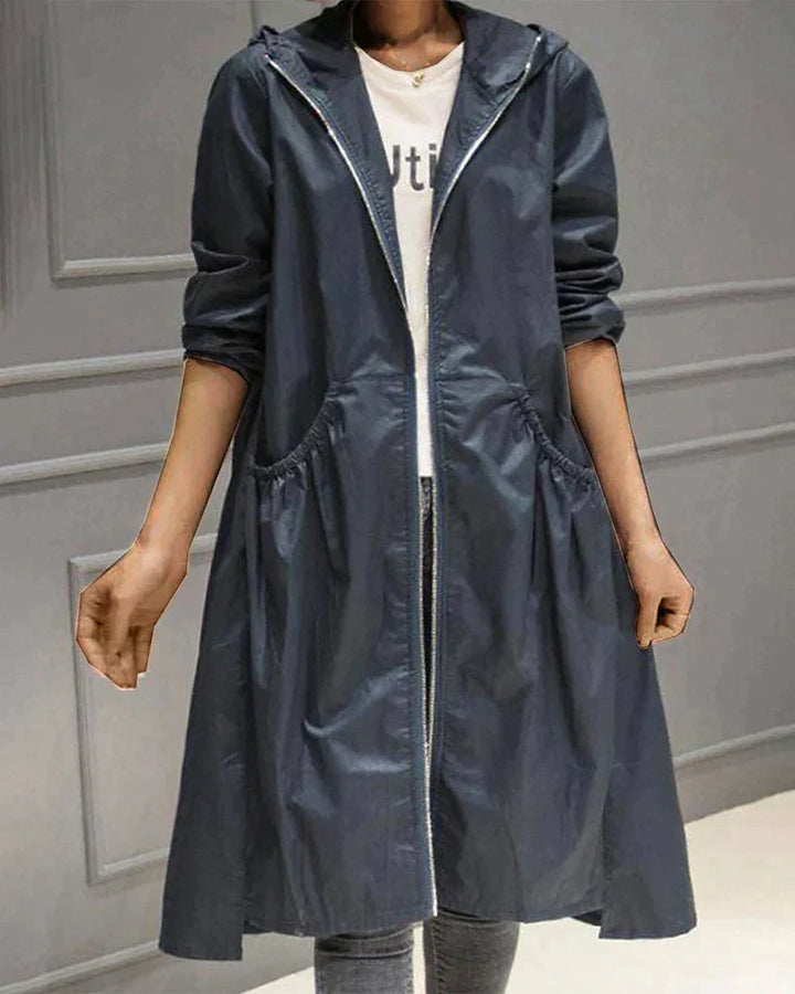 Women's all-weather waterproof jacket, hooded, knee-length, relaxed fit, a stylish & practical rain outerwear.