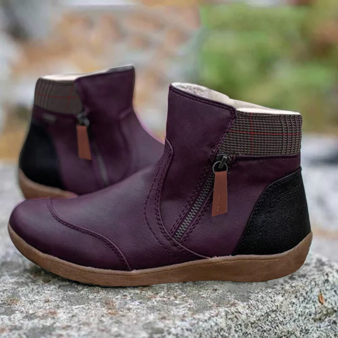 Elegant women's waterproof orthopedic ankle boots, offering warmth, comfort, & style for winter outings.