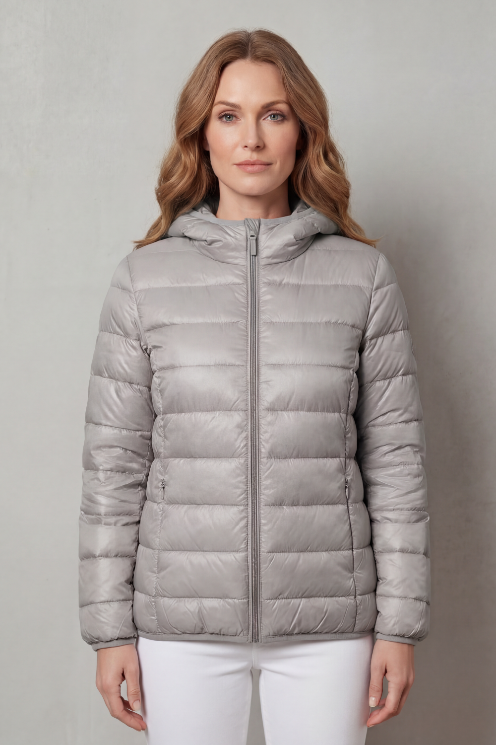 Detail of women's waterproof rain coat. Essential layering outerwear features for all-season comfort & protection.
