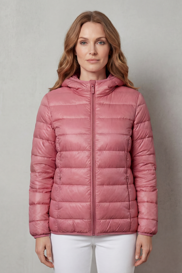 Woman in stylish waterproof rain jacket. Perfect layering outerwear for casual wear and all-weather protection.