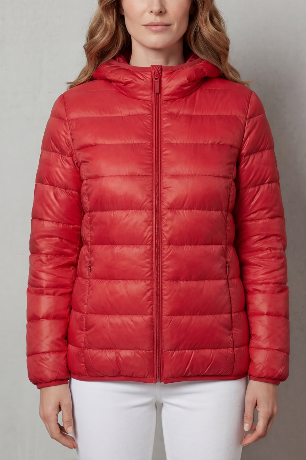 Back view of women's waterproof rain coat. Lightweight layering outerwear allows freedom of movement, all-season.