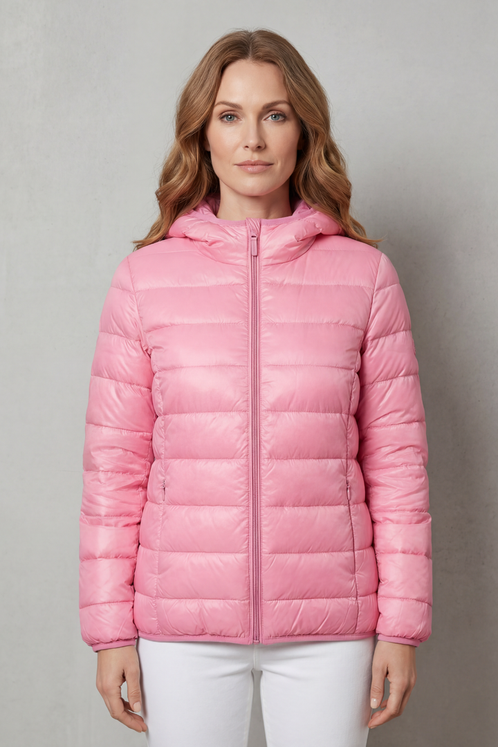 Stylish women's waterproof rain jacket. Ideal layering outerwear for all-weather protection and travel.