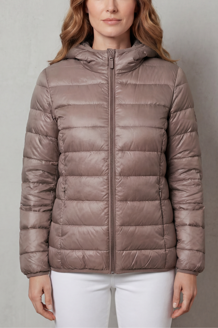 Fashionable women's waterproof rainwear. Essential layering coat for stylish all-season protection against rain.