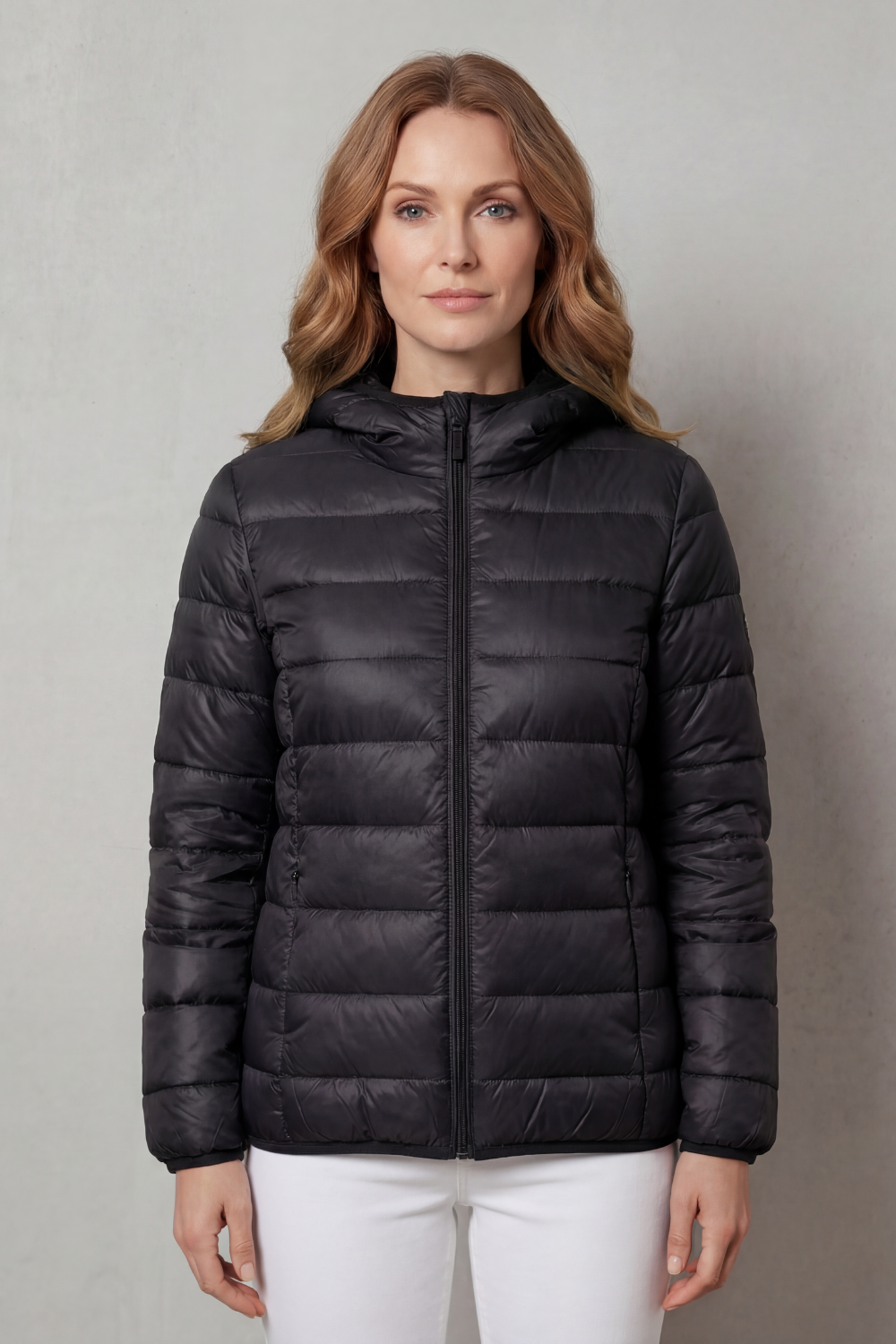 Hooded women's waterproof rain jacket. All-season layering outerwear for ultimate protection in wet weather.