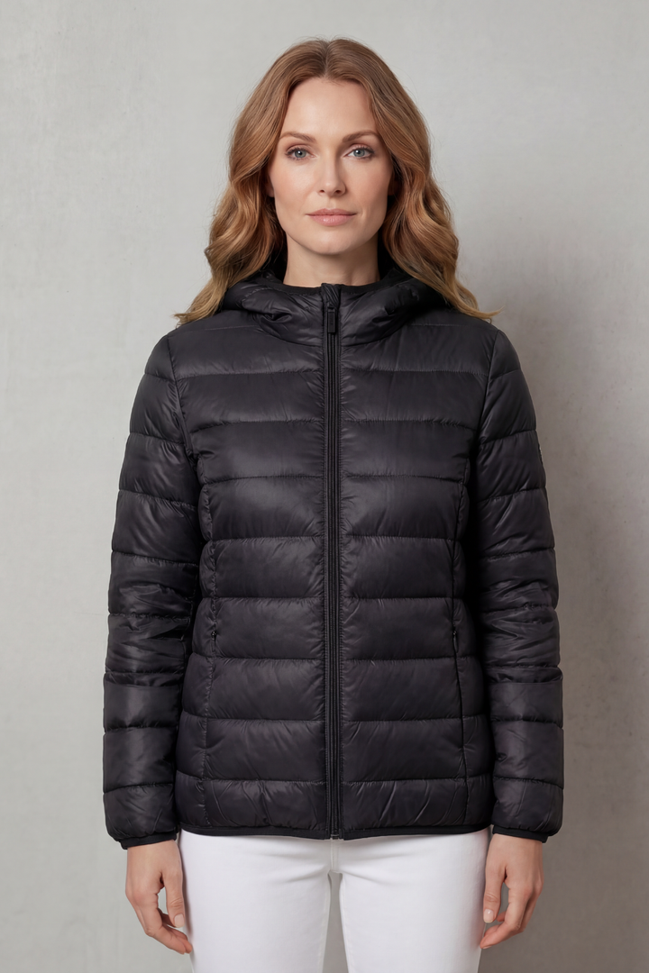 Hooded women's waterproof rain jacket. All-season layering outerwear for ultimate protection in wet weather.