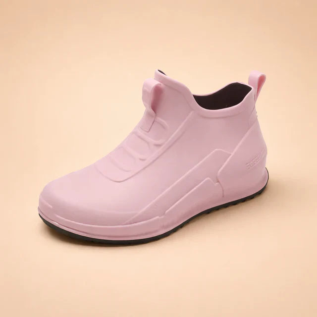 Comfortable women's slip-on ankle boots, waterproof, ensuring dry feet & everyday versatility.