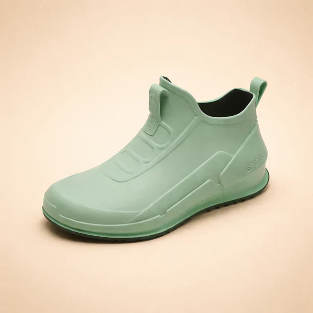 Stylish black women's waterproof ankle boots, slip-on design for ultimate comfort & walking.