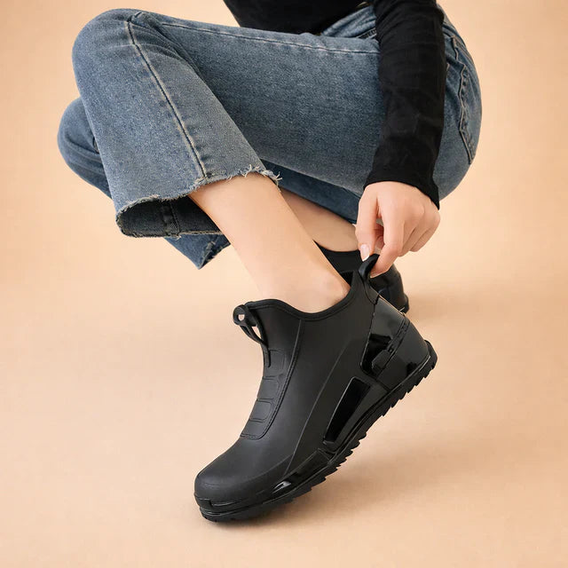 Durable women's waterproof slip-on ankle boots, black, excellent for walking, comfort, and rainy days.