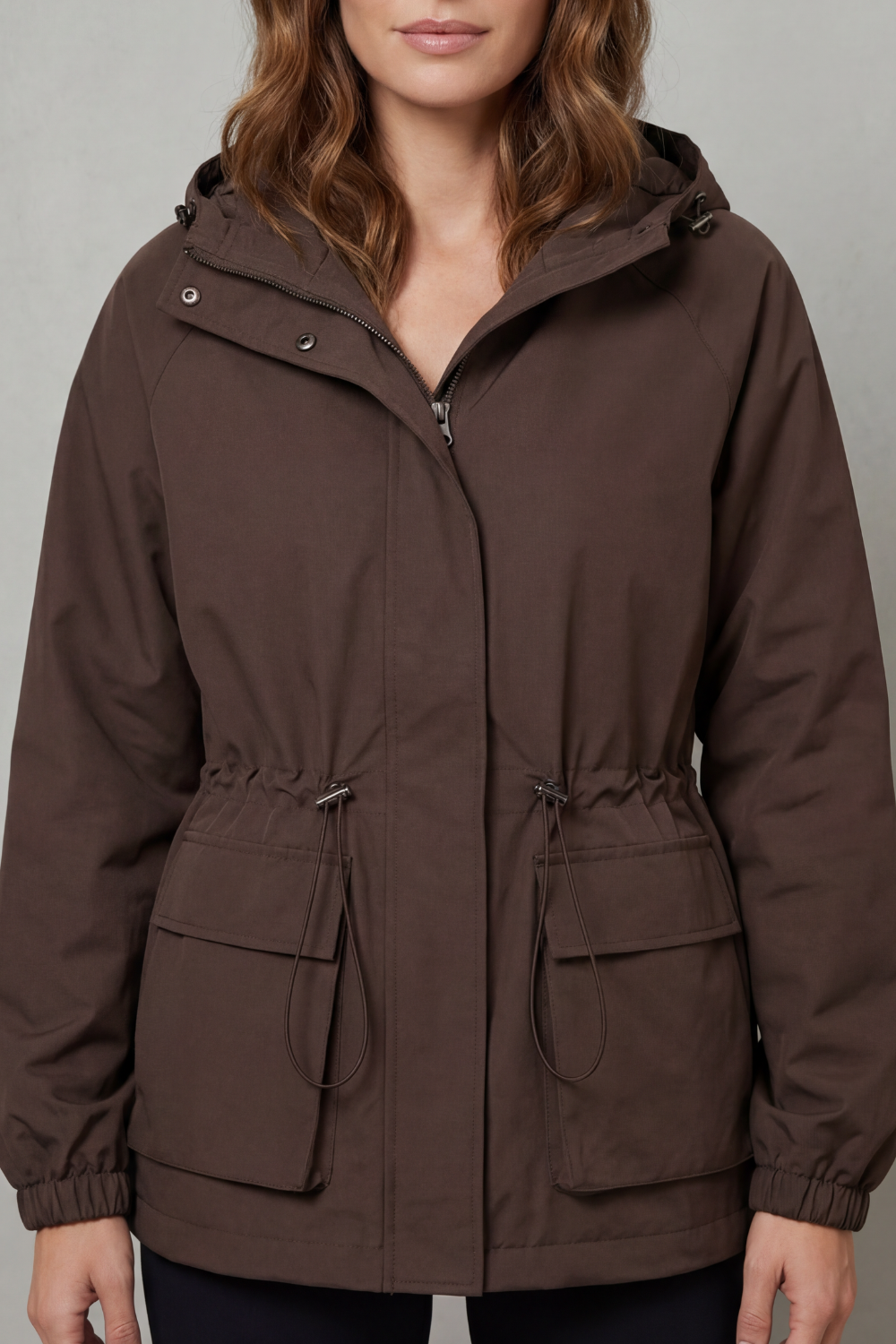 Women's waterproof utility jacket with drawstring, perfect for everyday wear.