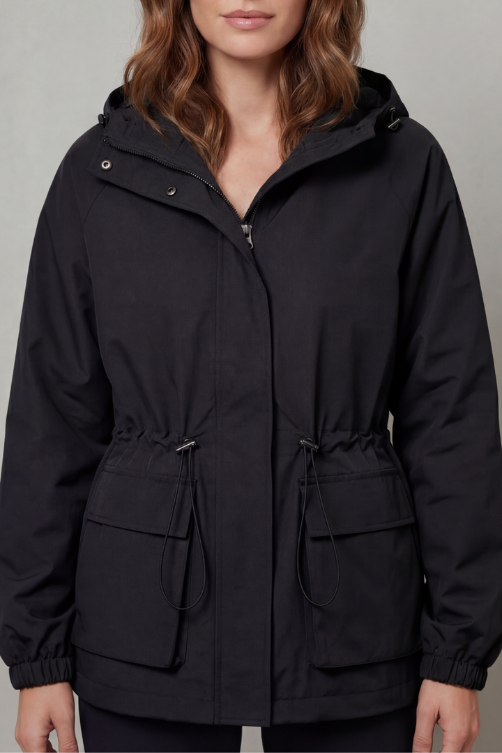 Women's waterproof utility jacket with drawstring, essential lightweight outerwear for rain.