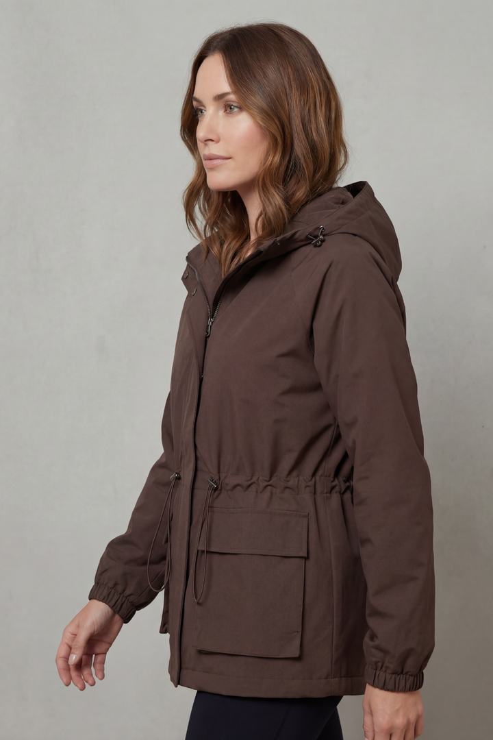 Stylish women's lightweight waterproof jacket with drawstring for casual wear.