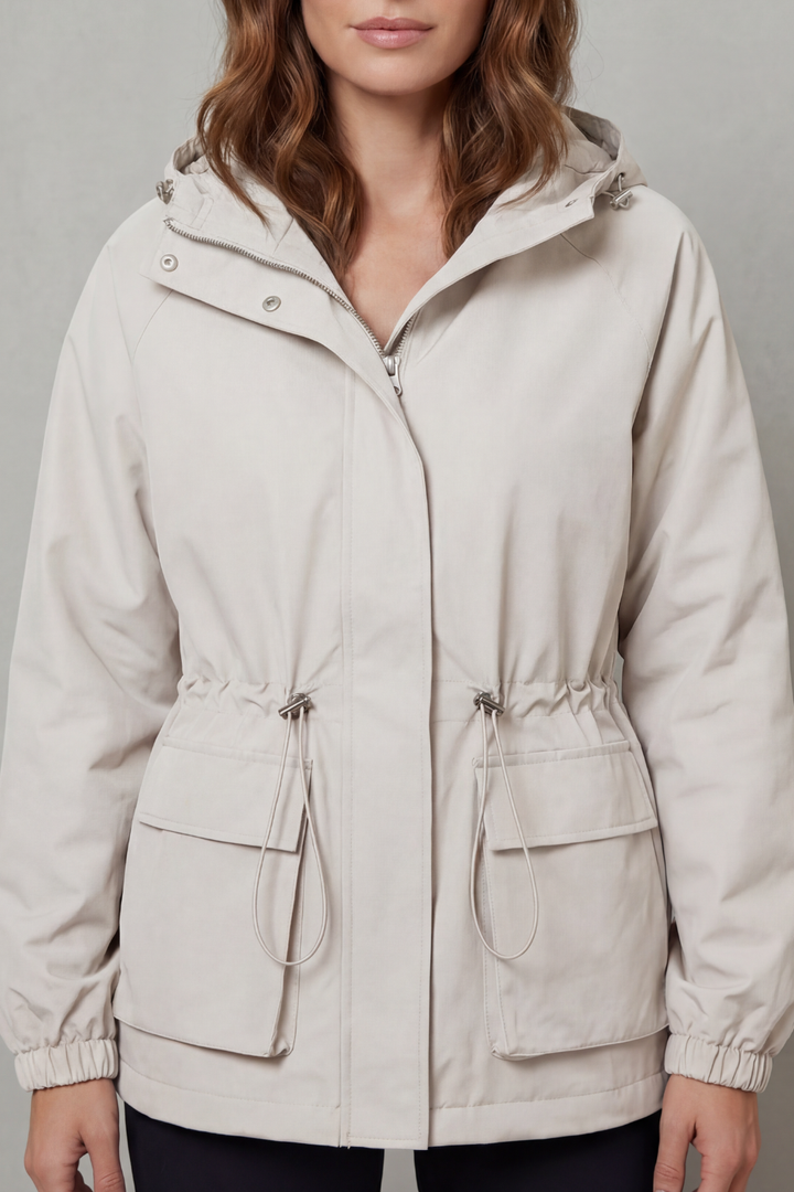 Women's utility drawstring waterproof jacket, ideal lightweight outerwear for outdoor activities.
