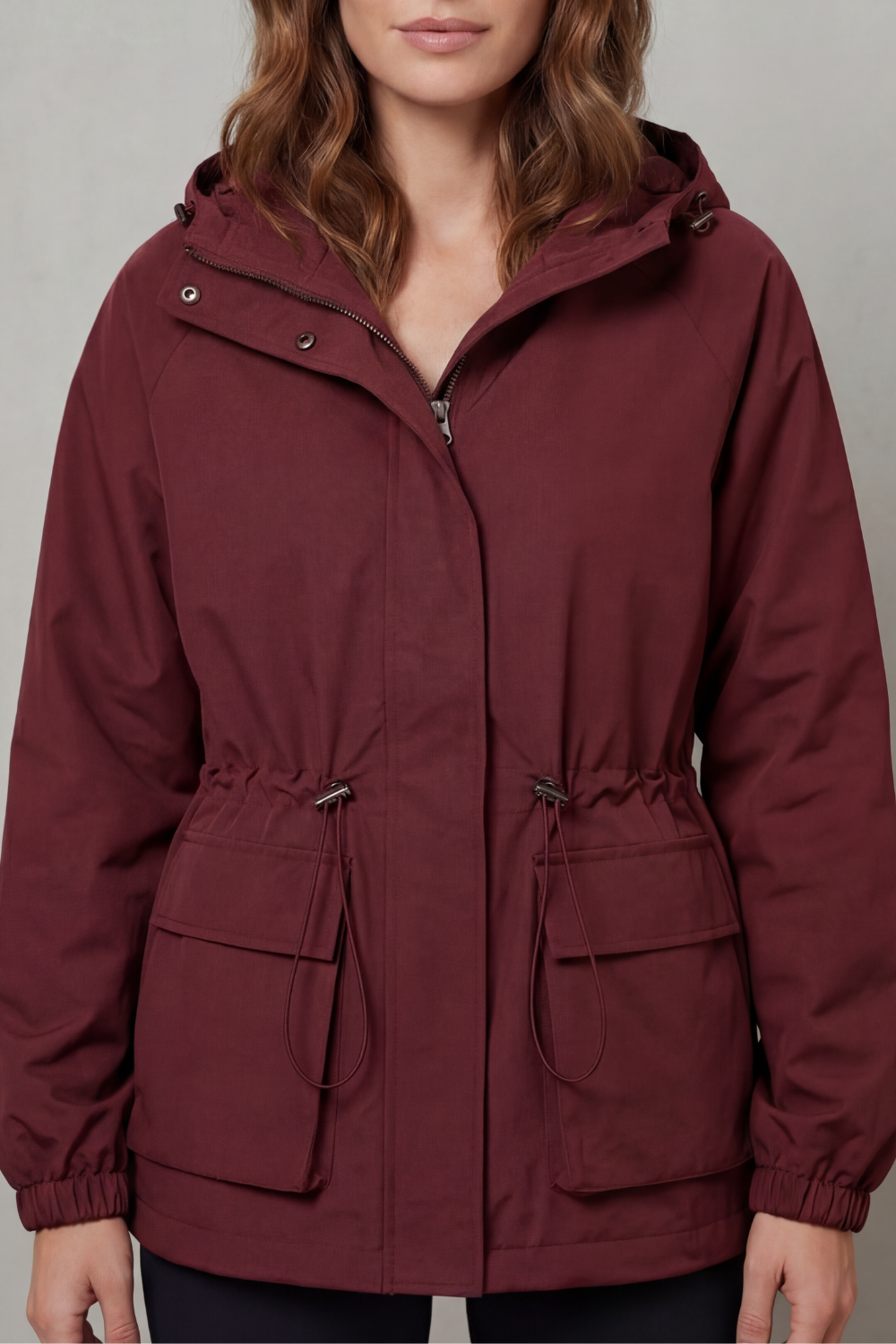 Everyday women's rain jacket, waterproof utility style with adjustable drawstring waist.