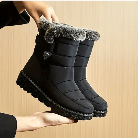 Warm women's waterproof winter ankle boots, ideal for cold weather outdoor activities, featuring a cozy lining.