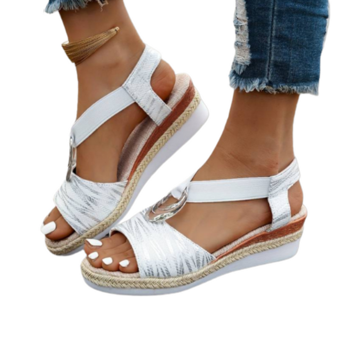 Stylish women's wedge sandals with comfortable cushioned sole. Versatile casual footwear for summer days.