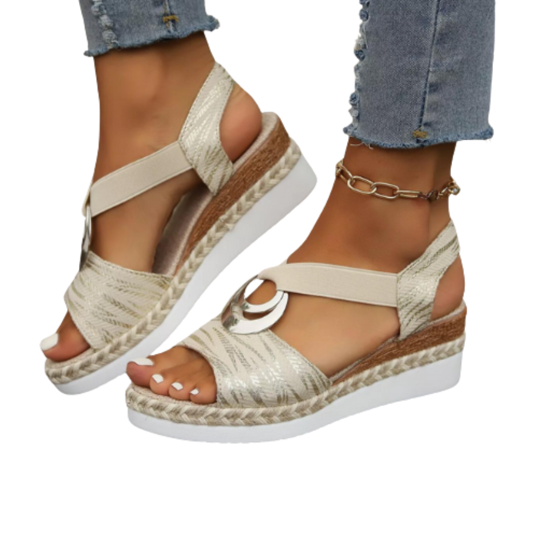 Supportive women's wedge sandals featuring a soft cushioned sole. Ideal summer comfort shoes for active wear.