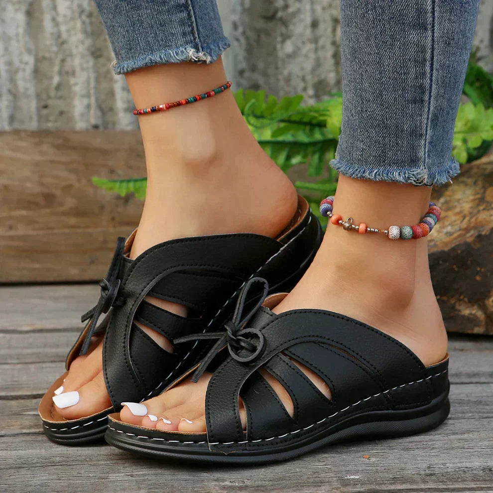 Stylish women's open-toe wedge sandals with a unique knot detail, offering comfort & perfect for casual outings.