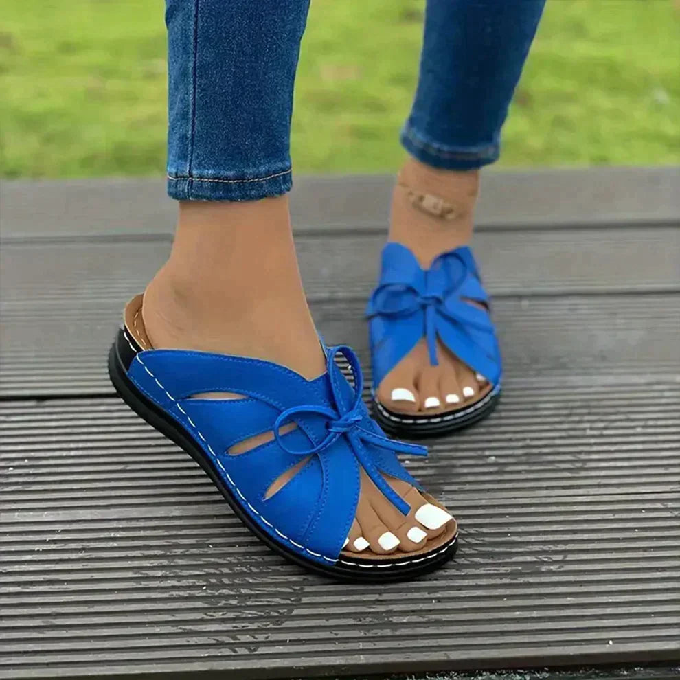 Elegant women's fashion sandals: open-toe wedge design with sophisticated knot detail & ultimate comfort fit.