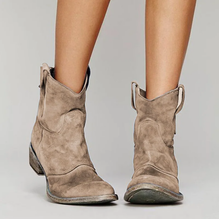Women's Western ankle boots with a comfortable block heel & pull tabs. Perfect for casual fall style.