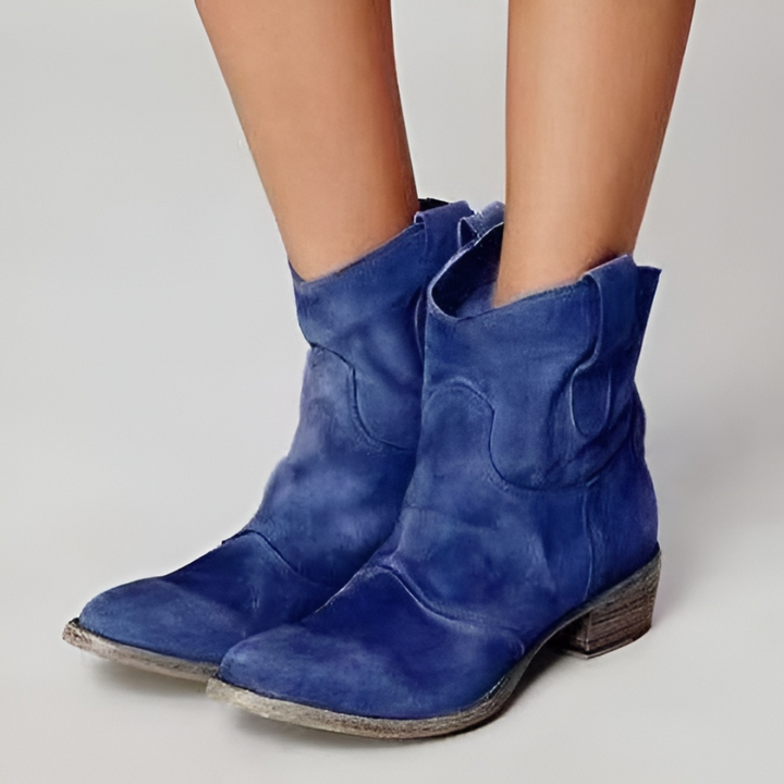 Comfortable women's ankle boots with a Western design and block heel, offering effortless everyday style.