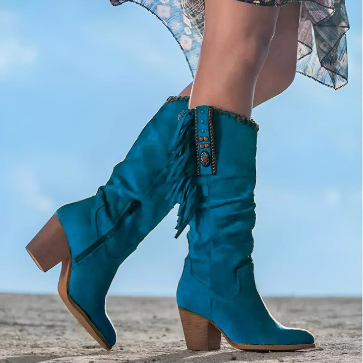 Fashionable women's Western boots; black slouchy knee-high style with fringe and a sturdy block heel.