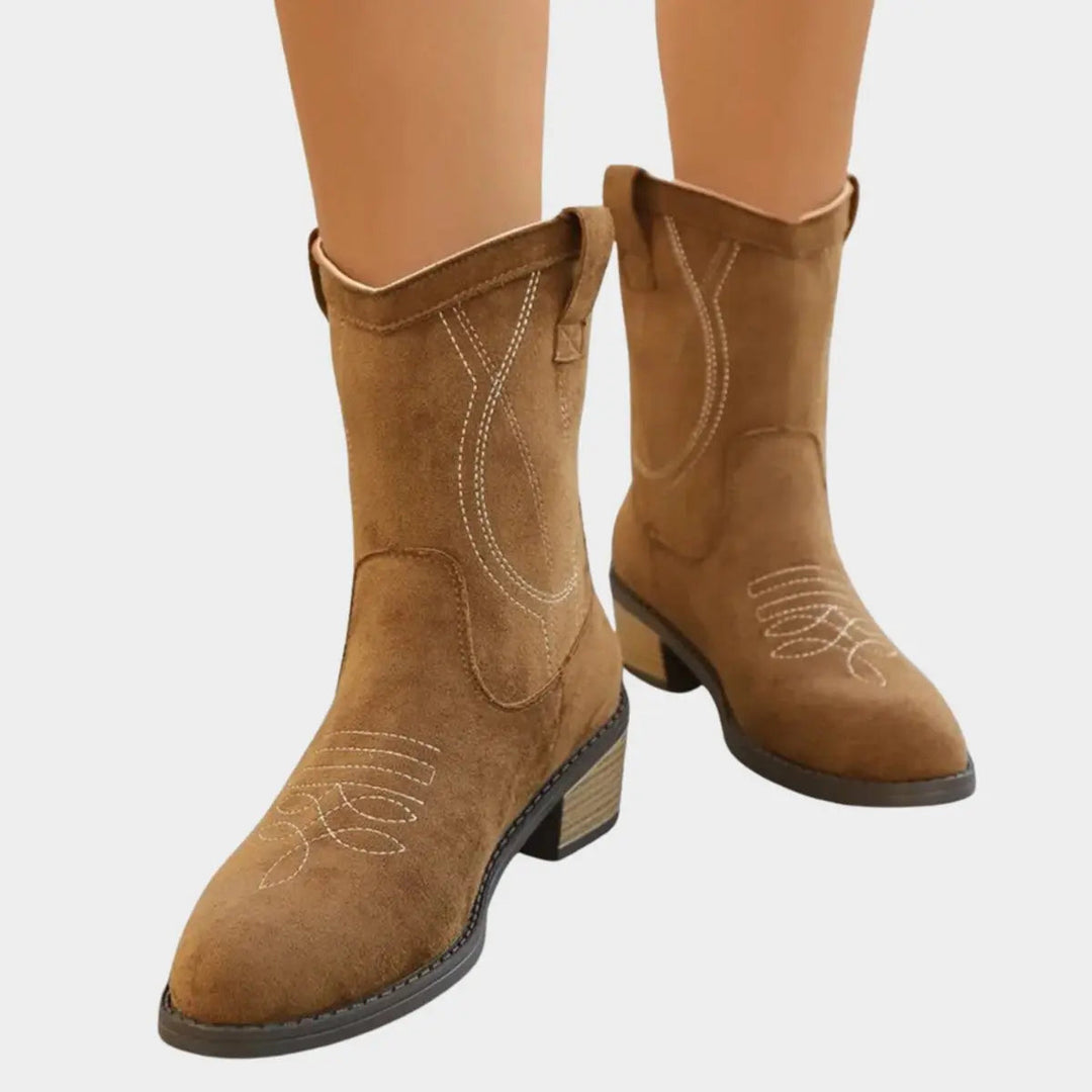 Stylish women's western ankle boots with detailed embroidery, perfect for festival wear or casual outfits.