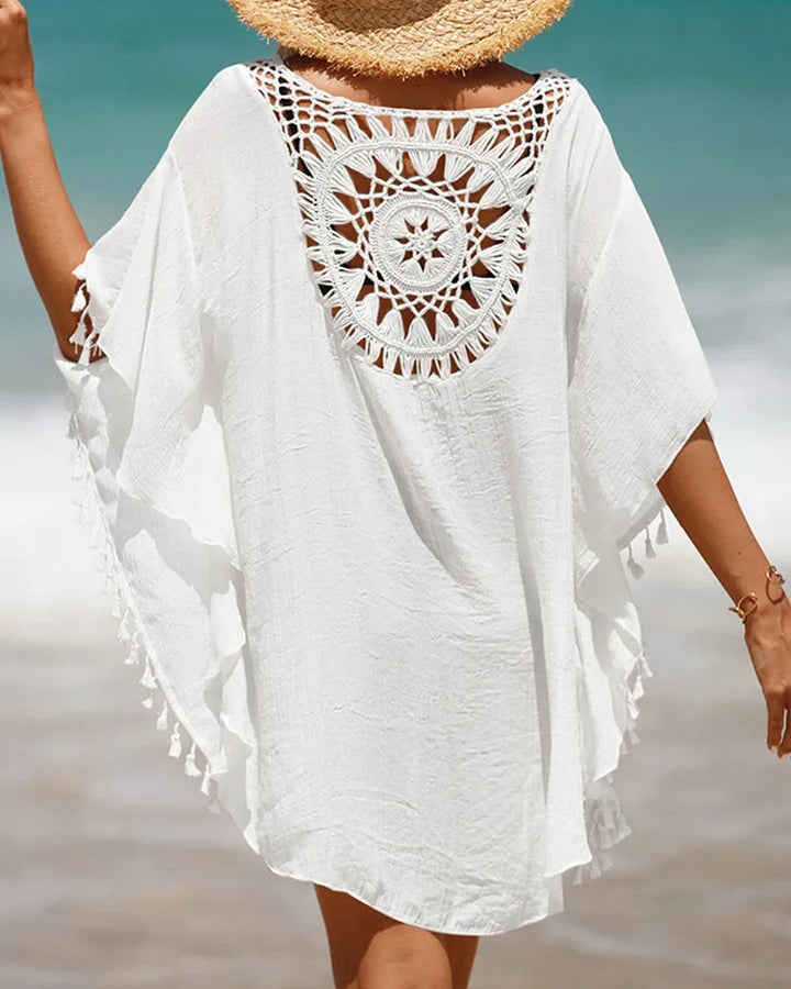 Women's white boho beach mini cover-up with crochet yoke, perfect for summer vacation and resort wear.