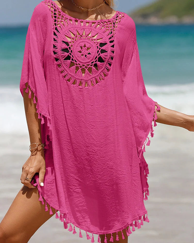 Women's beachwear cover-up: a white boho mini with chic crochet yoke and fun tasseled hem detail.