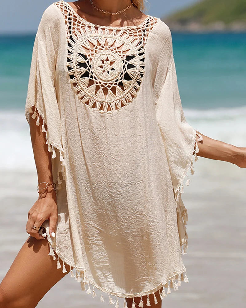 White women's boho beach cover-up, mini style, showcasing a beautiful crochet yoke and fringed tassels.