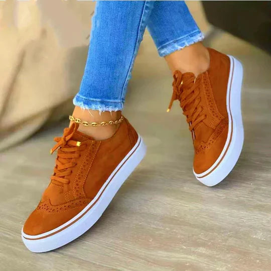 Stylish women's lace-up sneakers in a classic design, offering supreme comfort for walking.