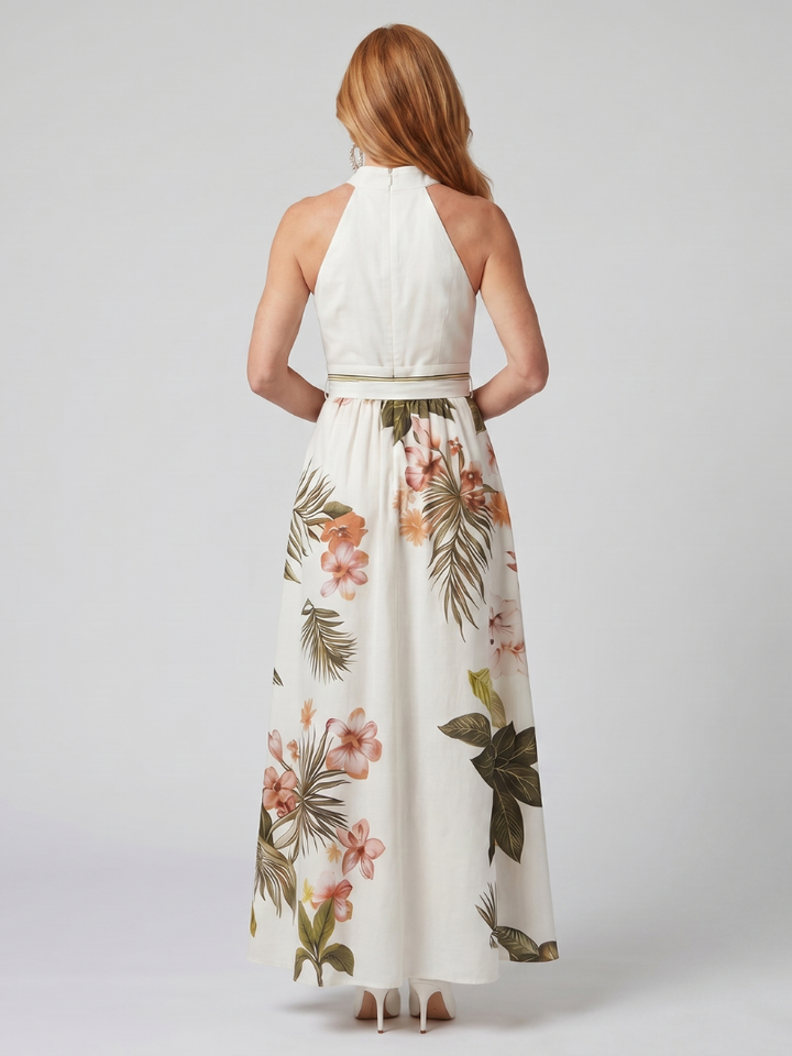 Draped halter maxi dress for women, white with botanical panel. Elegant, flowy, and perfect for summer vacation wear.