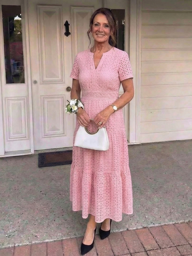 Casual women's short sleeve midi dress in breathable eyelet fabric, ideal for summer comfort.