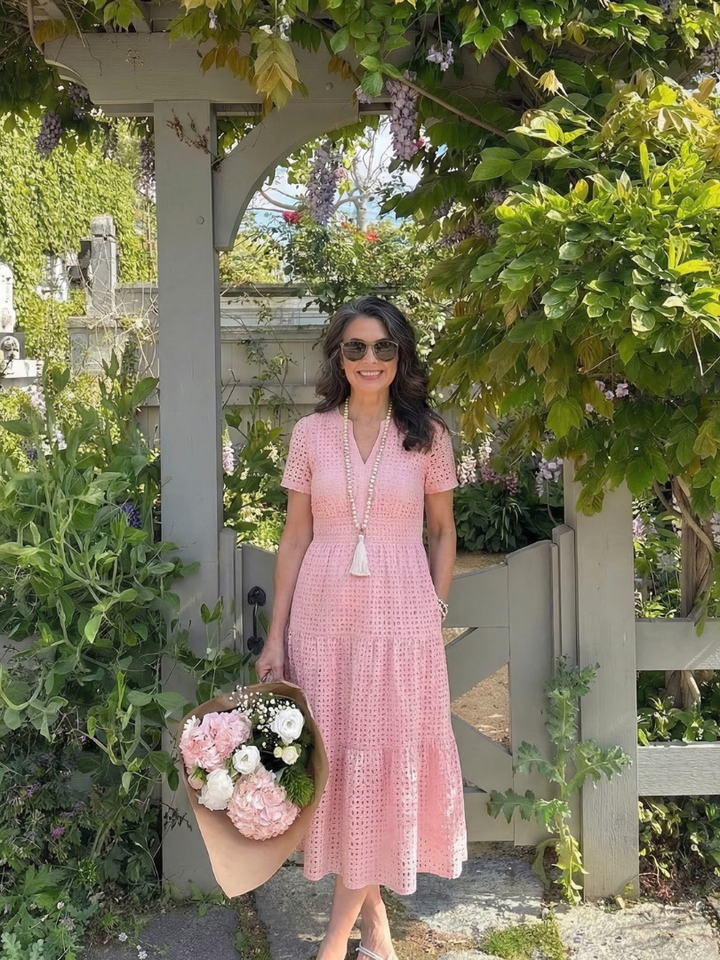 Elegant tiered eyelet midi dress for women, offering a comfortable and stylish short sleeve design.