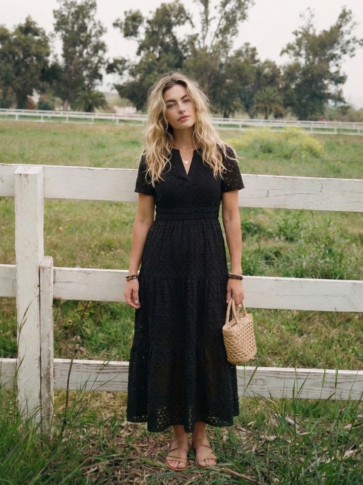 Stylish women's short sleeve day dress with eyelet details and a flattering tiered midi cut.