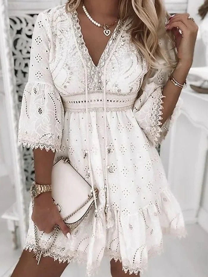 Yellow eyelet V-neck mini dress for women. Comfortable long-sleeve flared summer dress, ideal for daywear & holidays.