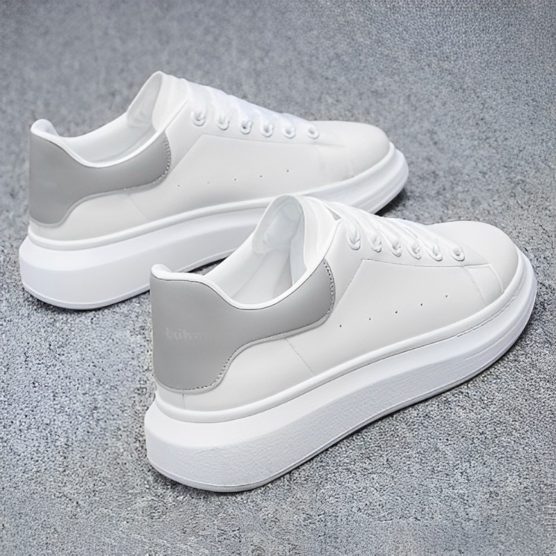 Black & white women's platform sneakers, stylish & comfortable chunky sole footwear for fashion-forward looks.