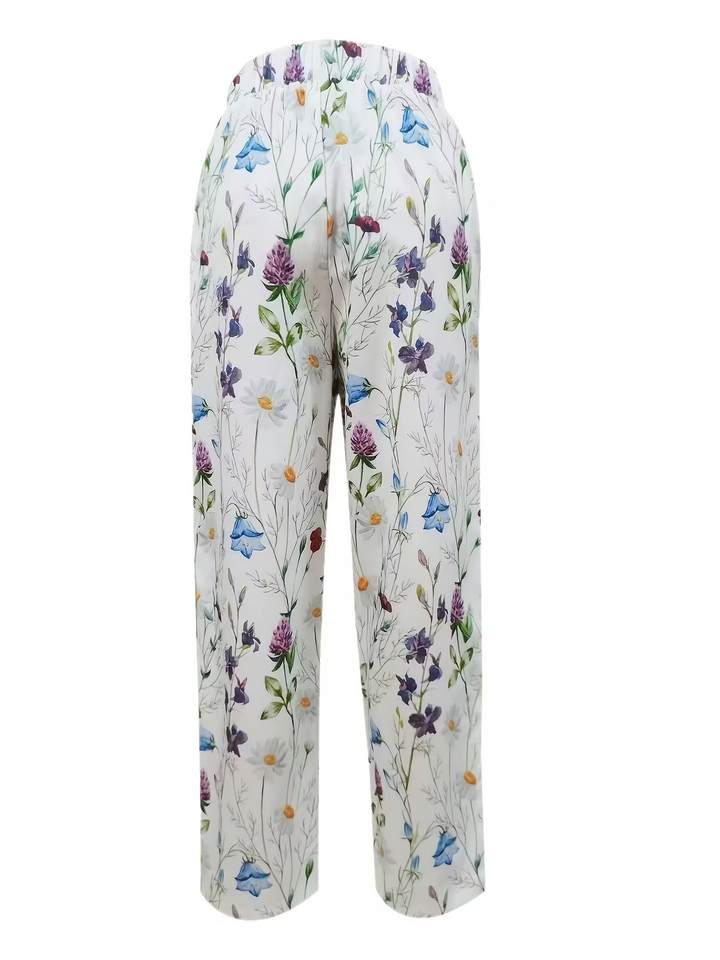 Flowy women's summer pants featuring a stylish floral print, wide leg, and comfortable elastic waist for effortless fashion.