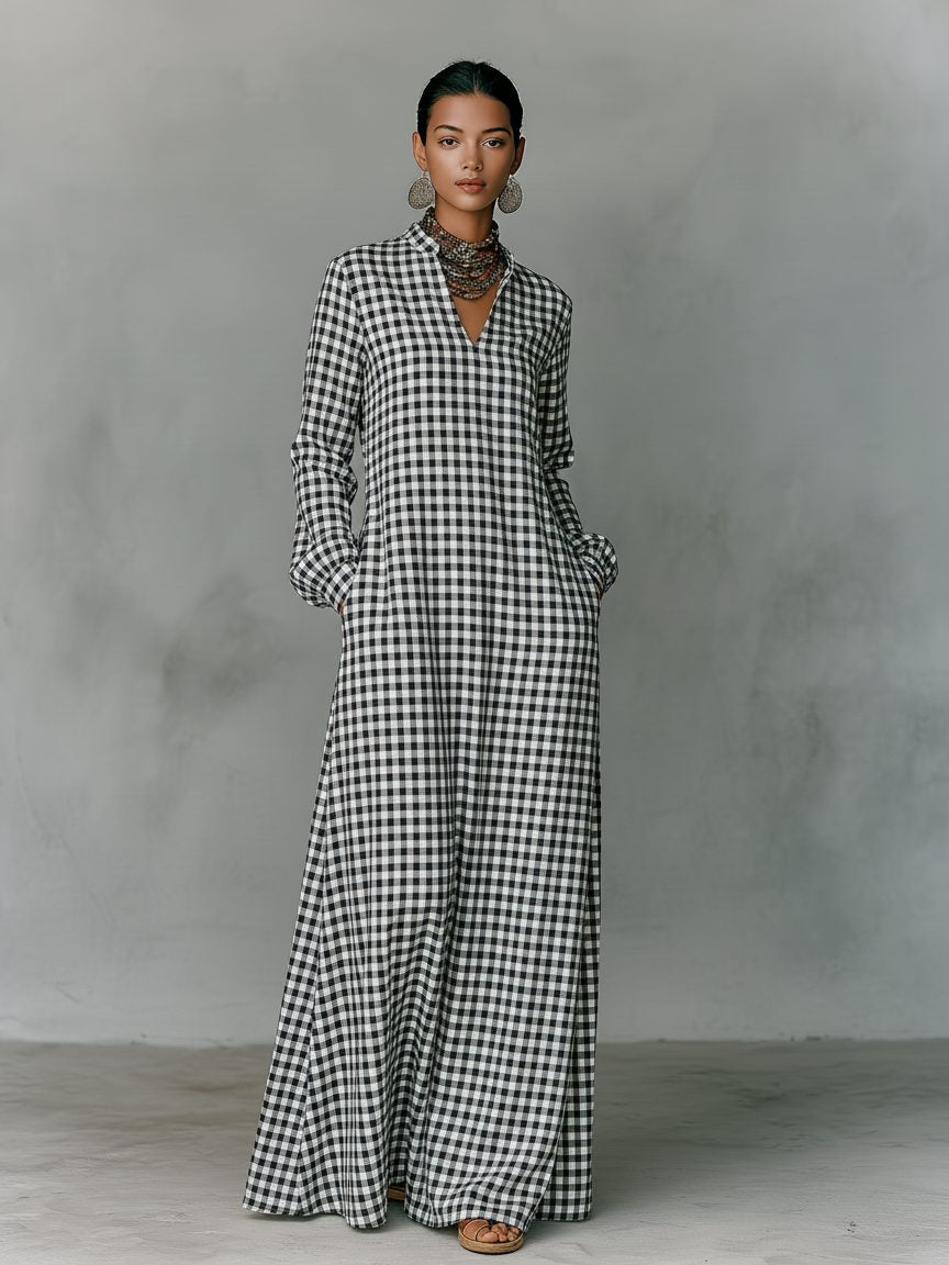 Stylish white women's V-neck maxi dress featuring a classic gingham pattern, long sleeves, and a flowing a-line skirt.