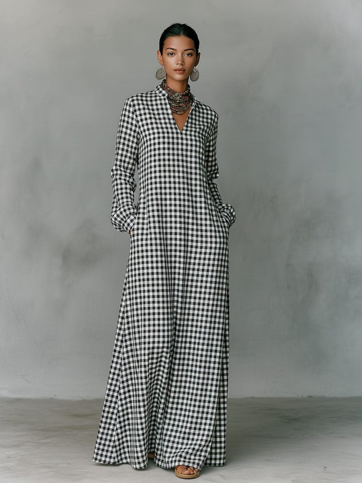 Stylish white women's V-neck maxi dress featuring a classic gingham pattern, long sleeves, and a flowing a-line skirt.