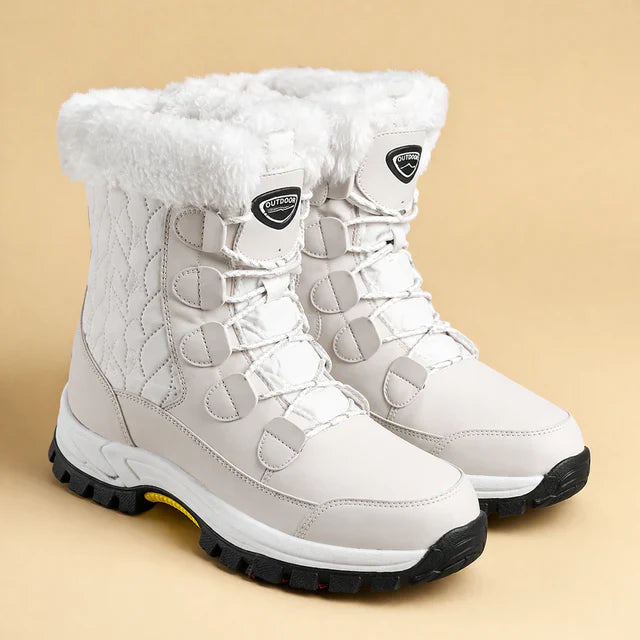 Women's white insulated winter snow boots, warm, stylish & anti-slip for cold weather comfort.